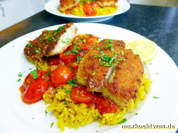 Seelachsschnitzel mit scharfer Tomatensauce und Curryreis